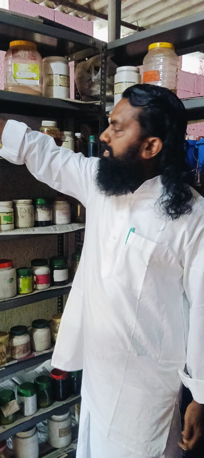 Vaidyar at the in-house herbal pharmacy 2